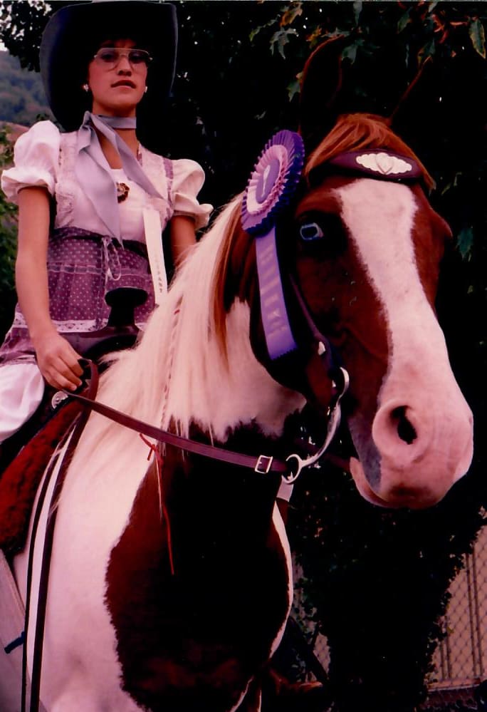 Tobi Rose Rabaliati dressed as Patsy Cline on her horse Shadow during a 4-H costume event