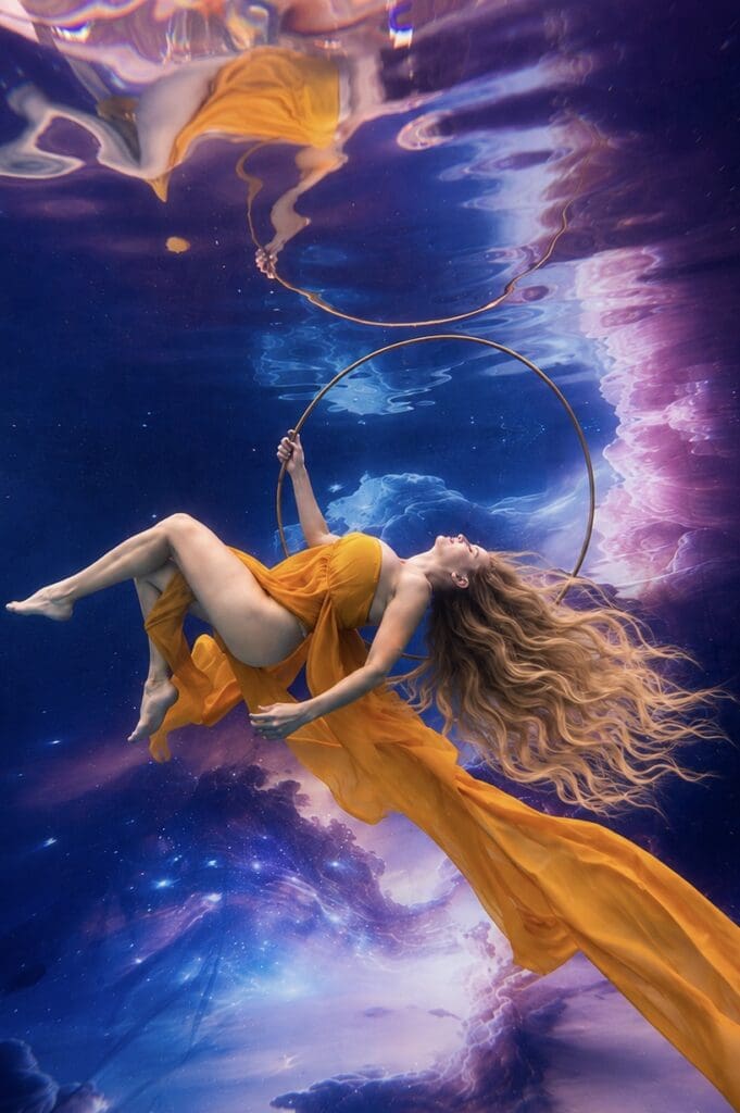 Tobi Rose Rabaliati modeling underwater in Kimber Greenwood’s pool in Gainesville, Florida, photographed by Kimber Greenwood of Water Bear Photography during an underwater portrait photography session.