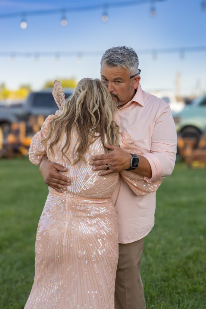 Letty and her husband Alex dancing together during her 50th birthday party in their backyard in Hood River, Oregon, photographed by Tobi Rose Photography.