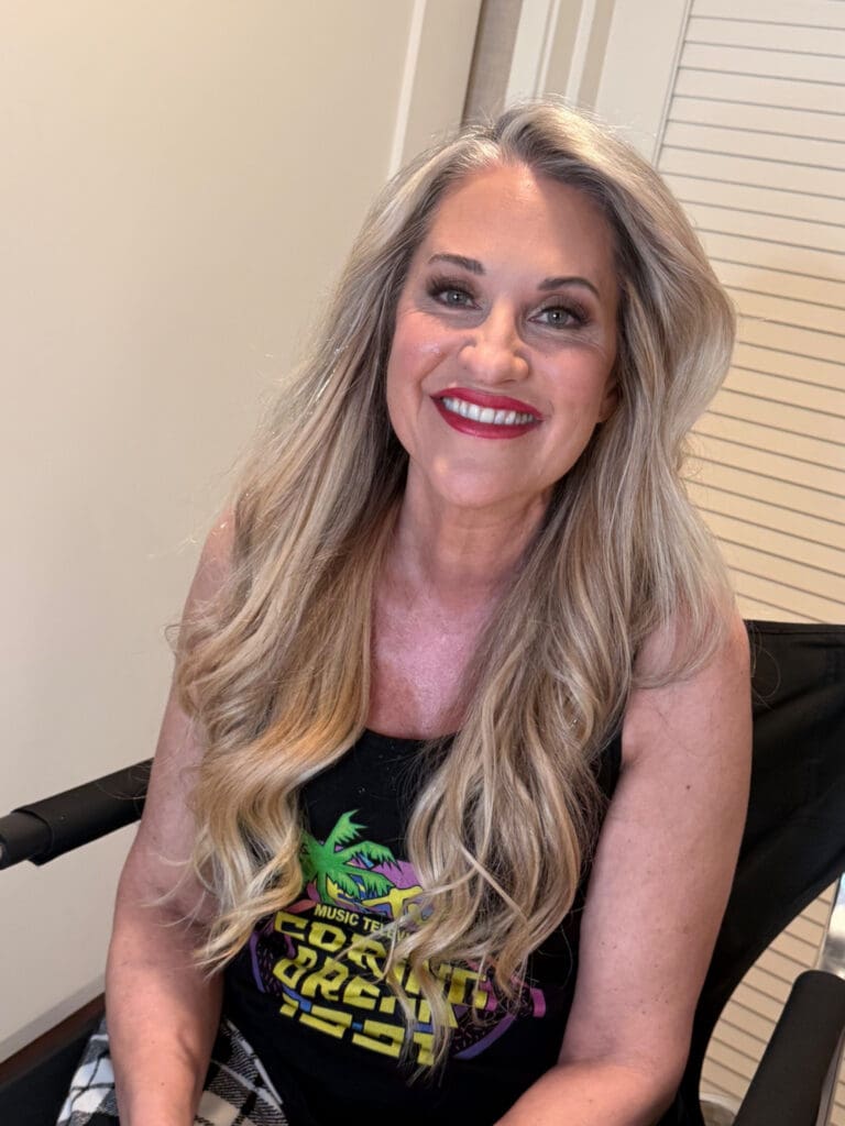 Tobi Rose Rabaliati smiling after professional hair and makeup by Las Vegas beauty stylist Janessa Mazzeo before her boudoir session with photographer Marco Ibáñez.
