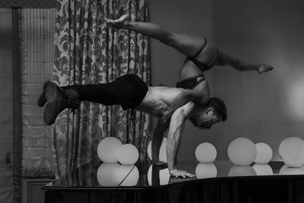 Holland Lohse and Sienna Martinez perform an acrobatic balance pose photographed by Tobi Rose Rabaliati at WPPI 2026